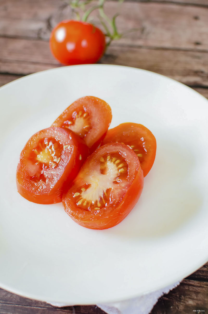 tomato sliced and plated ready for topping. 