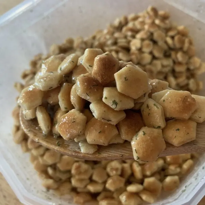 Finished ranch oyster crackers on a spoon ready to serve