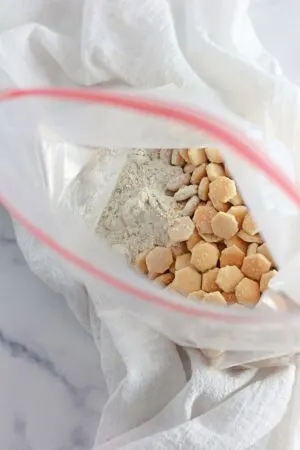 crackers in a bag with seasoning poured on top