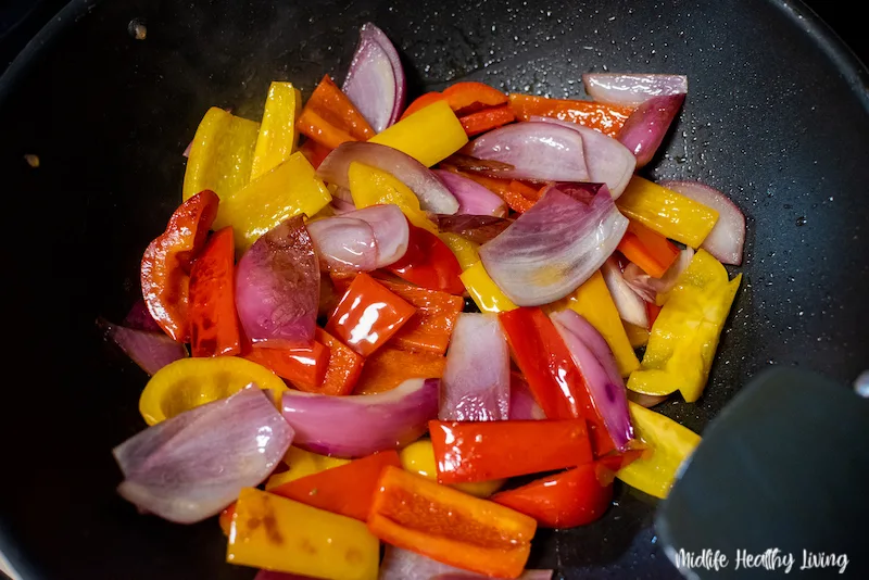 cooking peppers and onions