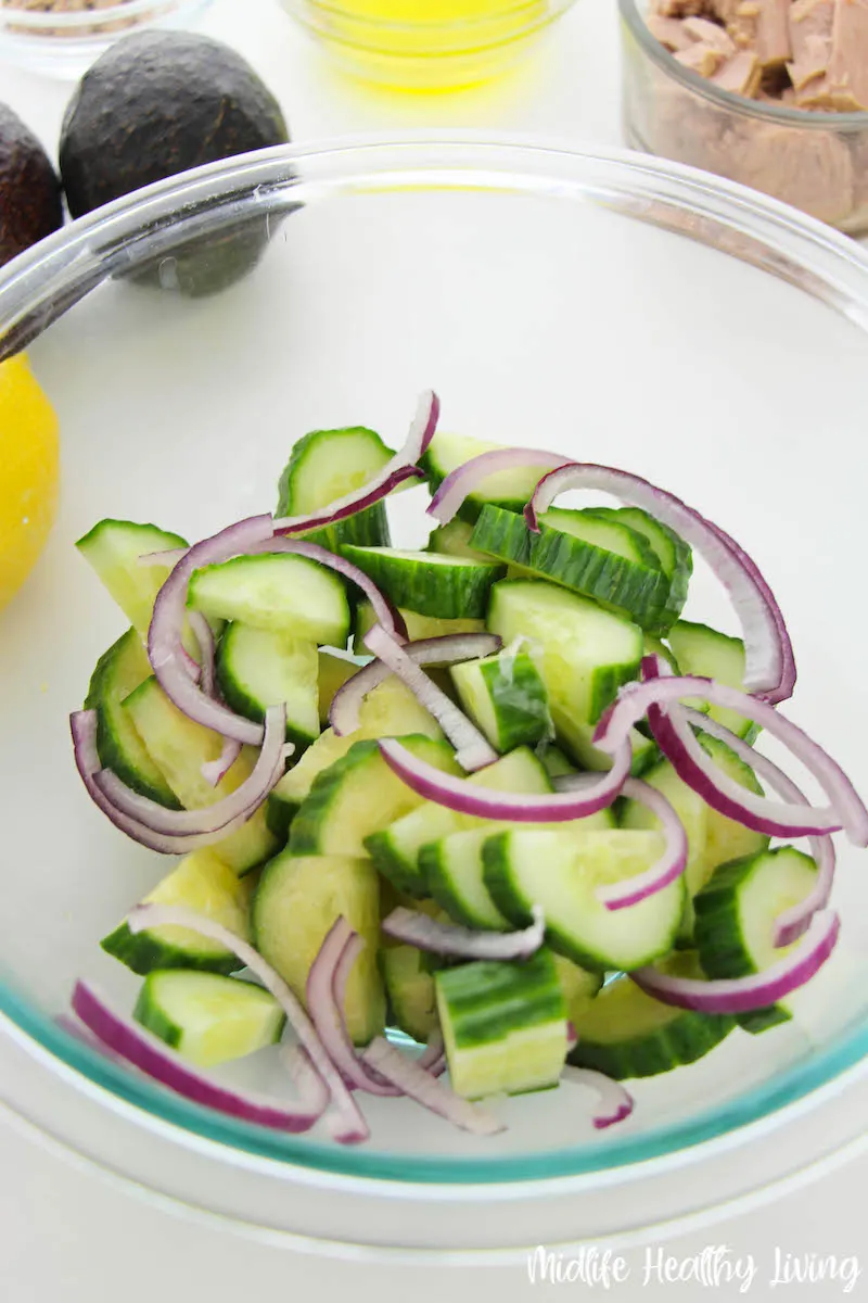 ingredients in a bowl ready to be mixed with dressing.