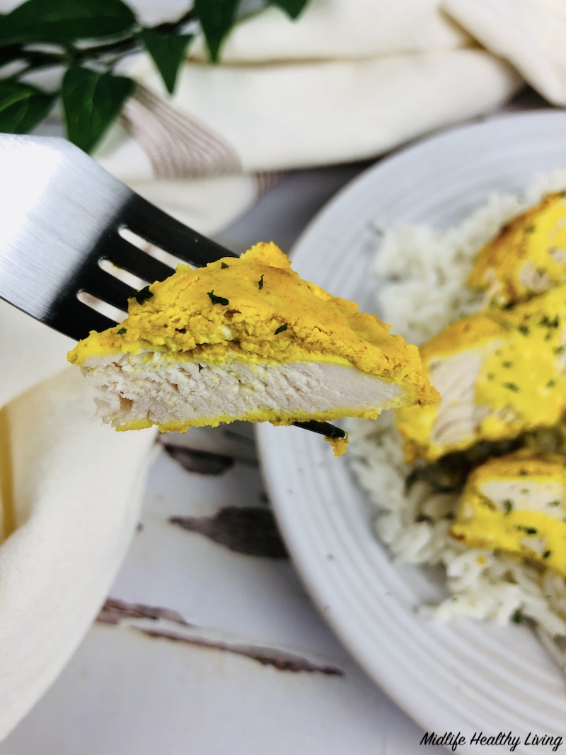 bite of finished turmeric chicken for weight watchers. 