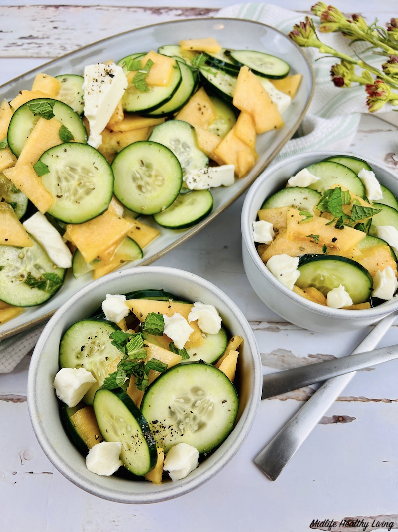 bowls full of the finished cantaloupe salad ready to eat