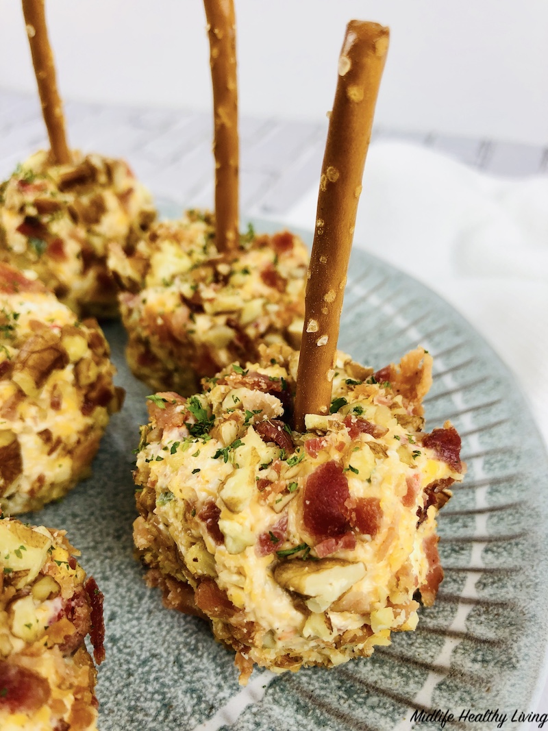 pretzel stick inserted and ready to serve the healthy cheese ball recipe