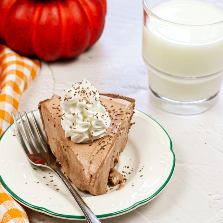 Featured image showing a slice of the finished chocolate pumpkin pie.