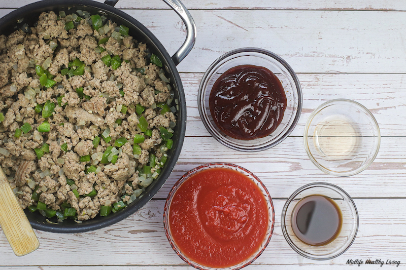 Adding in the sauces and more seasonings to create the sauce of the ground turkey sloppy joes
