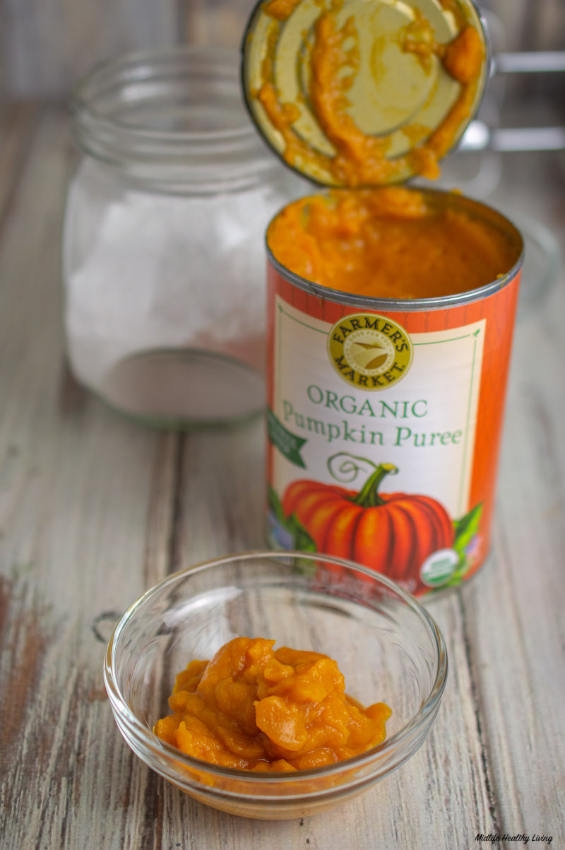 canned pumpkin open with some in bowl in front