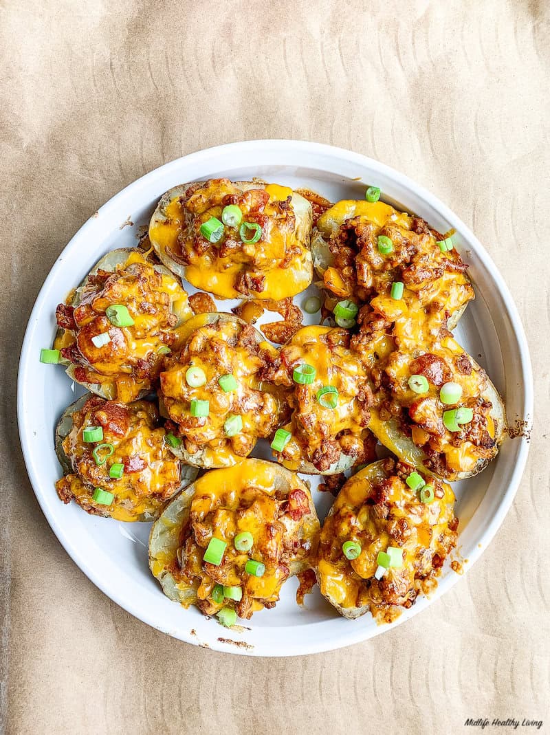 top down look at a finished plate of ground turkey stuffed potato skins