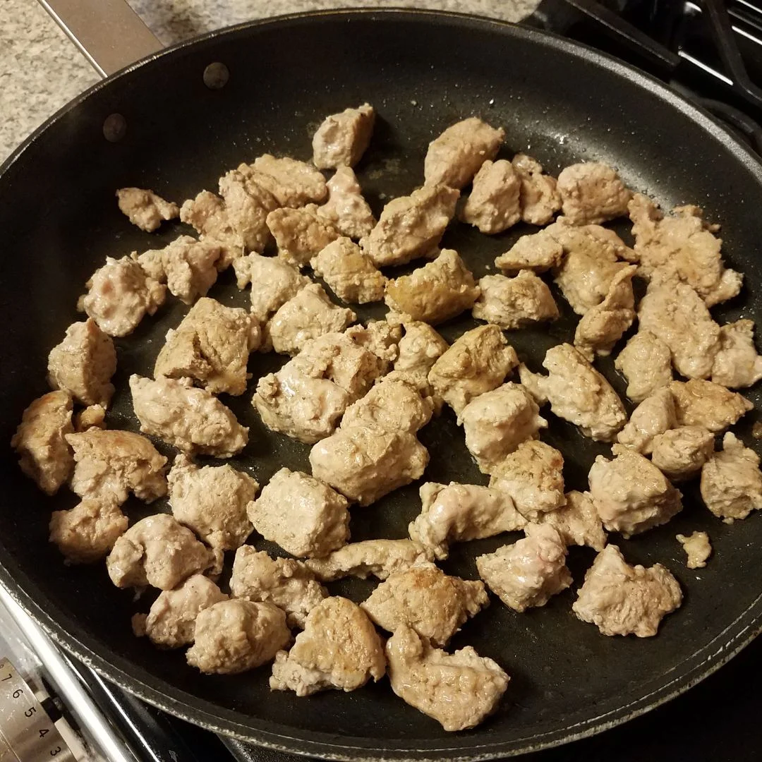 ground turkey cooking in a frying pan. 