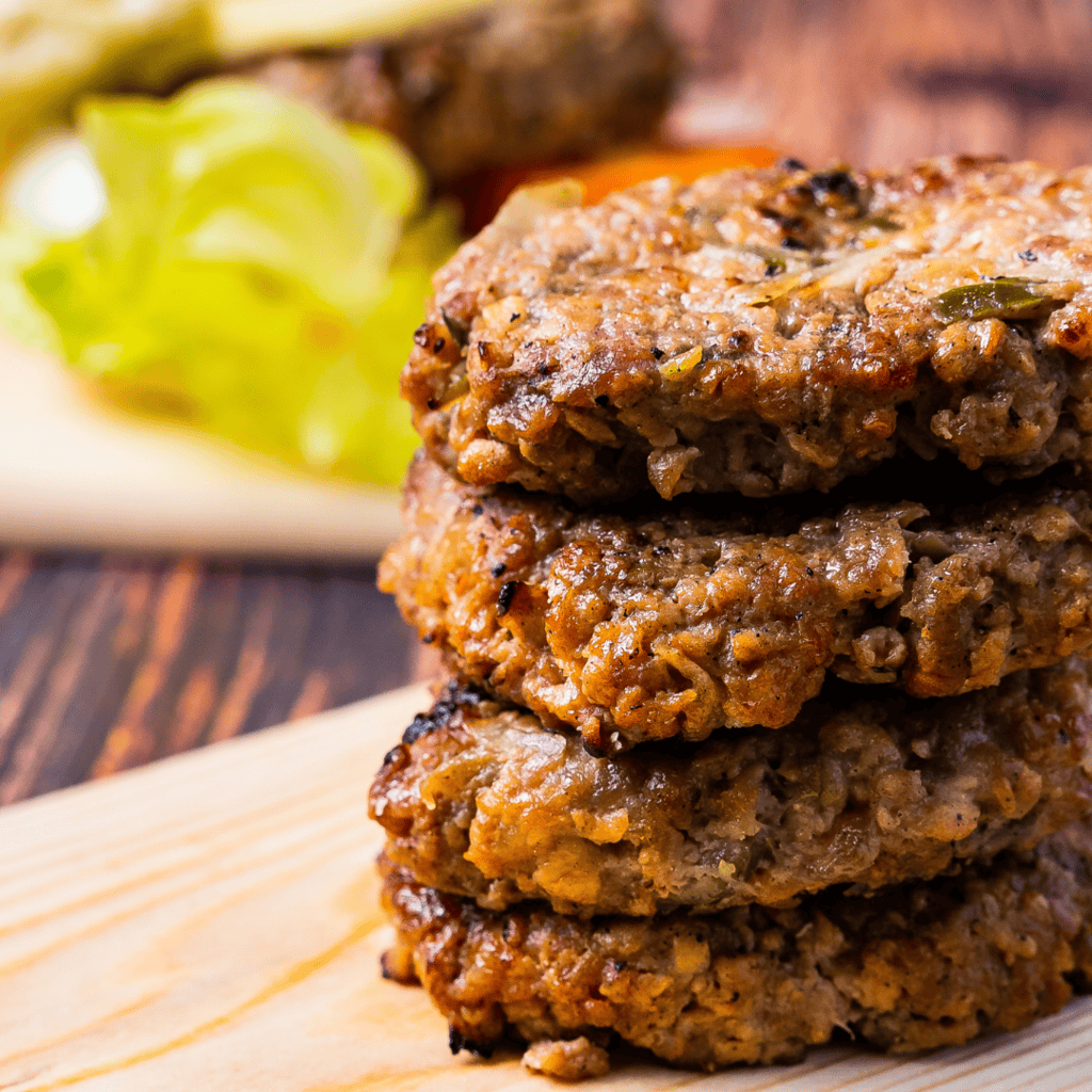 turkey burgers with mushrooms ready to be put on buns and served. 