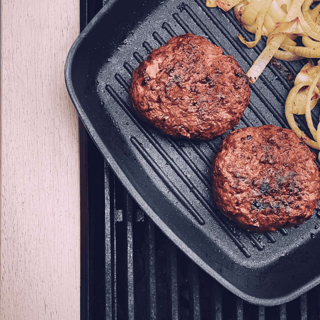 cooked ground turkey patties ready to be made into burgers. 