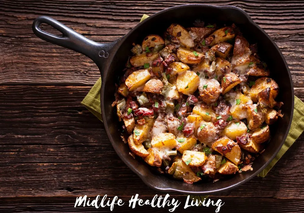 A ground turkey dish with potato, bacon, and cheese, in a cast iron skillet.