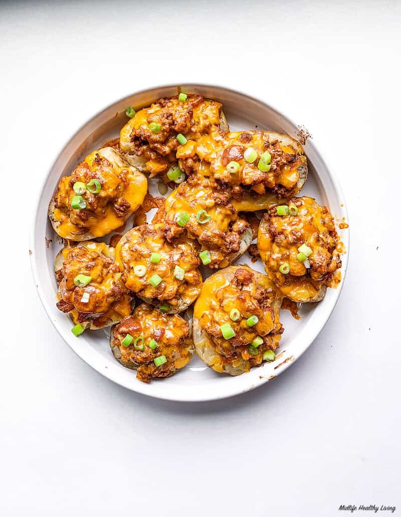 top down look at a plate full of the finished ground turkey stuffed potato skins