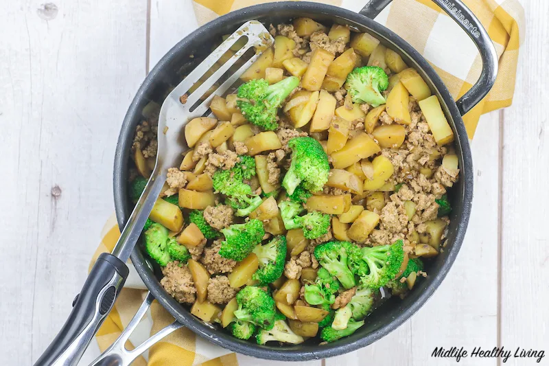 Cooking potatoes with the rest of the ingredients in a skillet