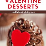 Pin image showing a chocolate cupcake with a red heart on the icing. It says 17 Healthy Valentine Desserts.