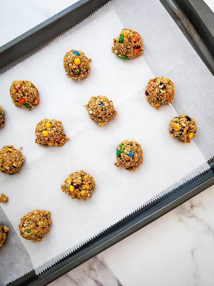 Ingredients combined into balls on a baking sheet