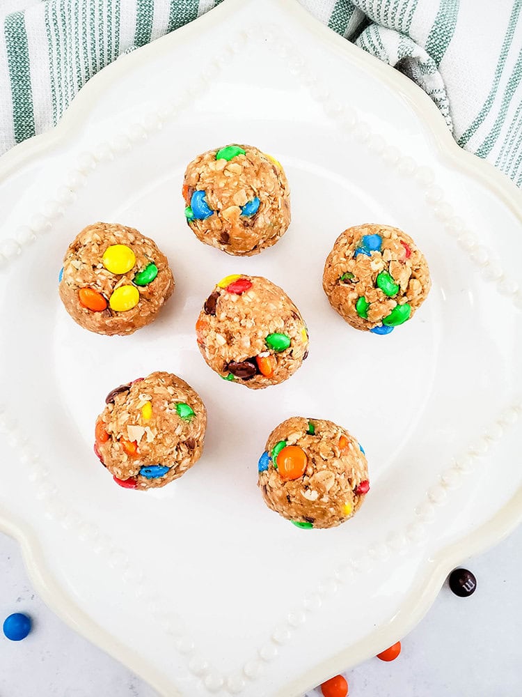 Complete energy balls on a white plate pictured from above.