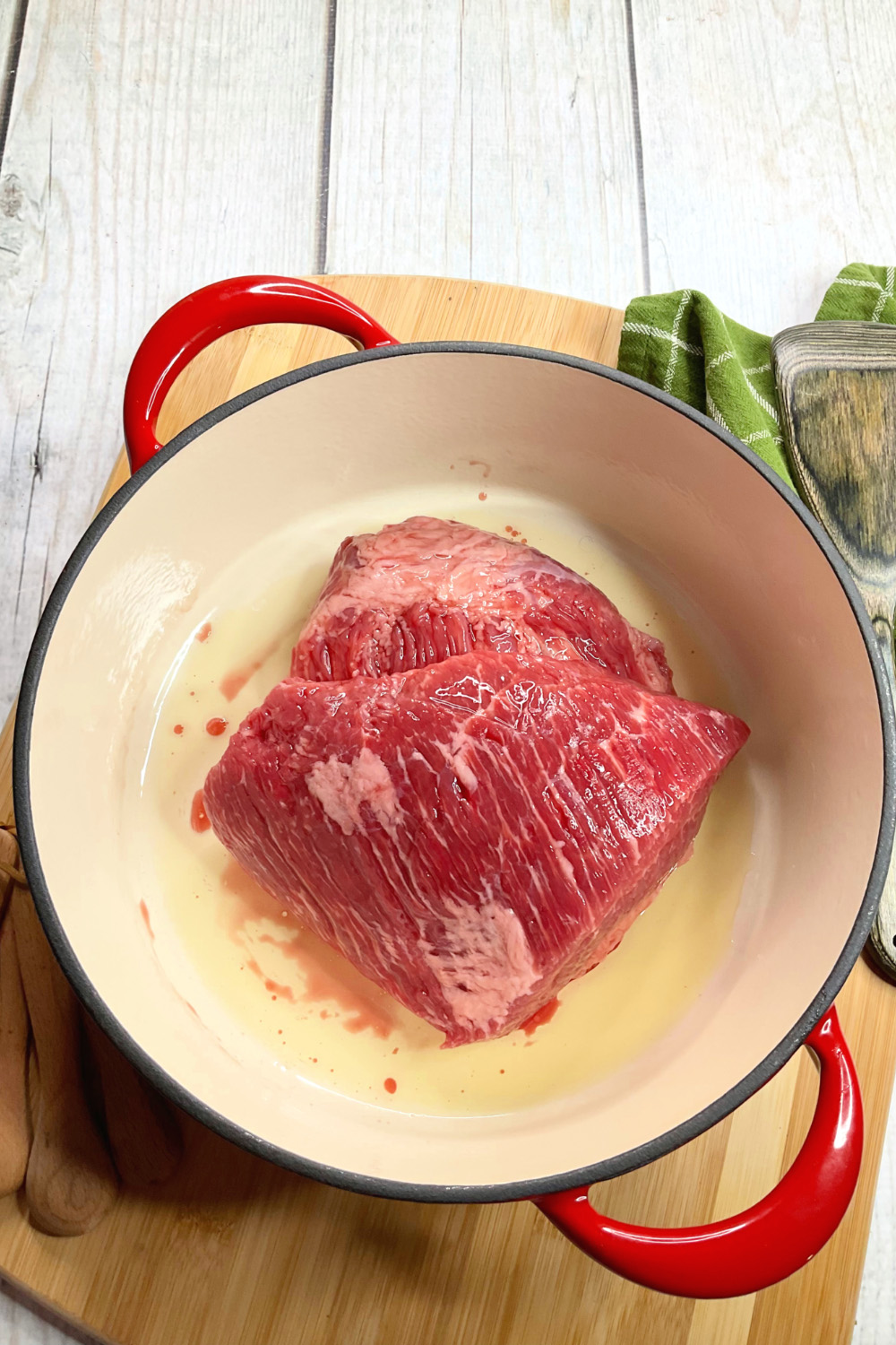 raw corned beef in a dutch oven