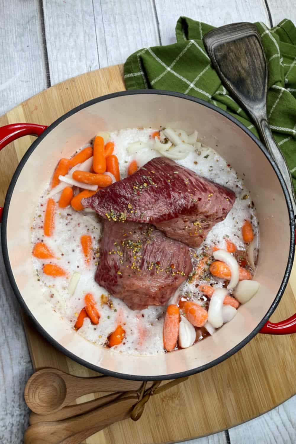 corned beef in a dutch oven with vegetables