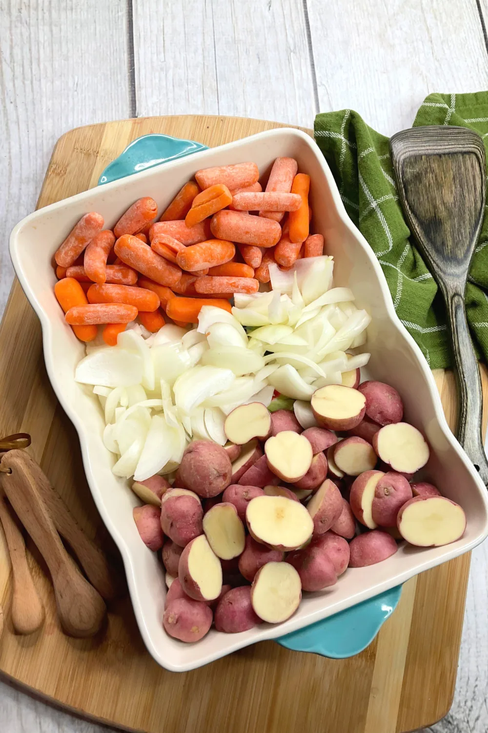 Platter of carrots, onions, and potatoes