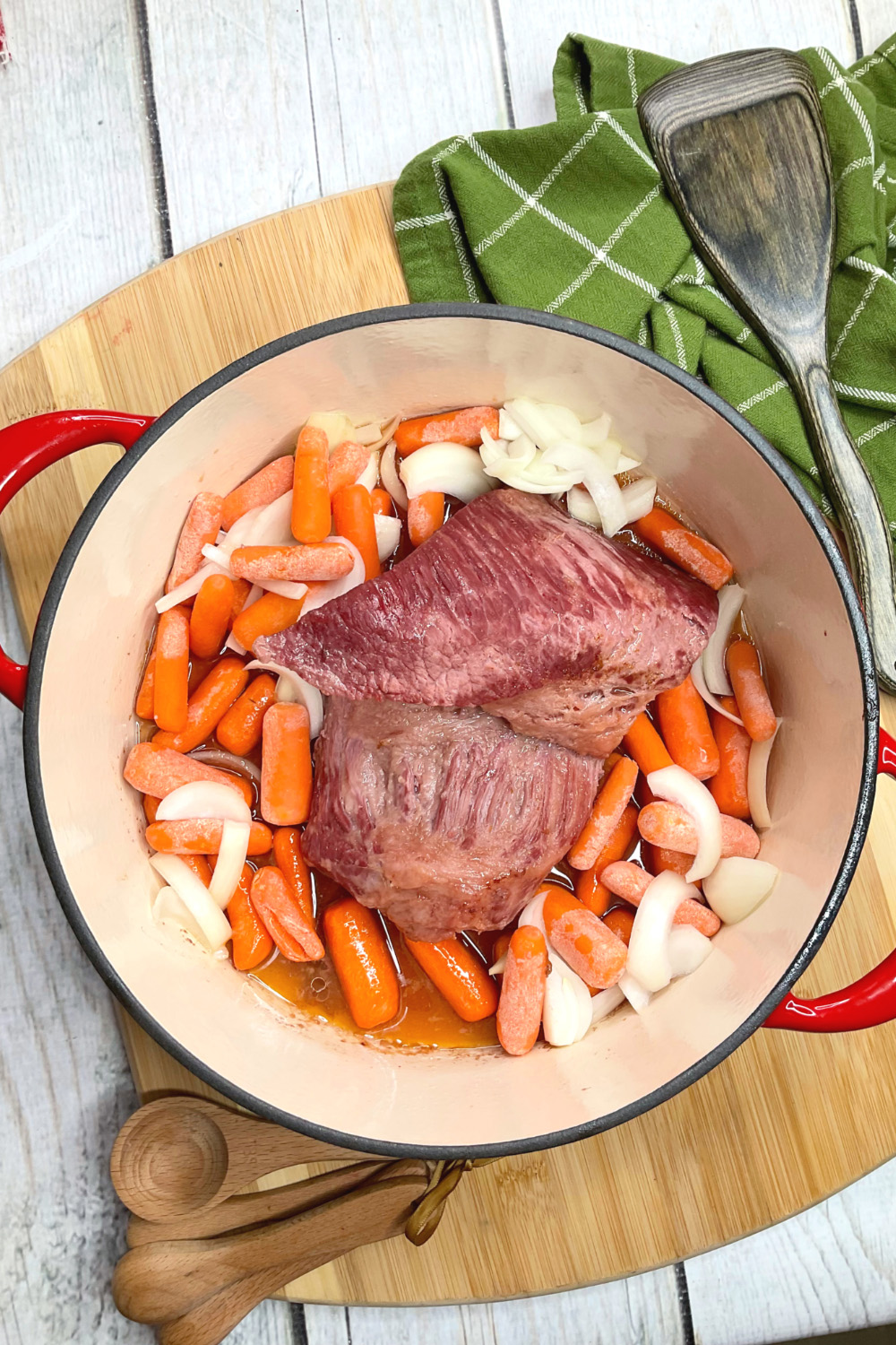 corned beef in a dutch oven with vegetables