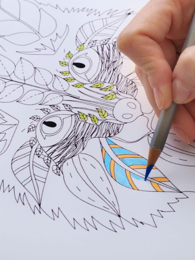 Someone coloring in a picture of a fox with leaves