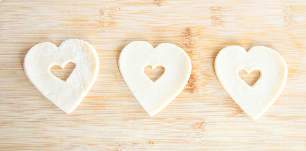the dough with heart cut outs in the middle