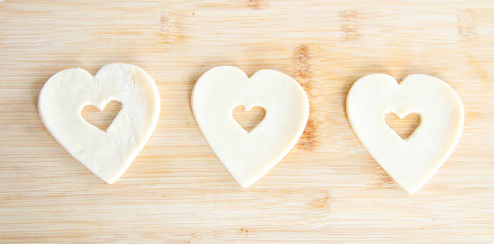 the dough with heart cut outs in the middle
