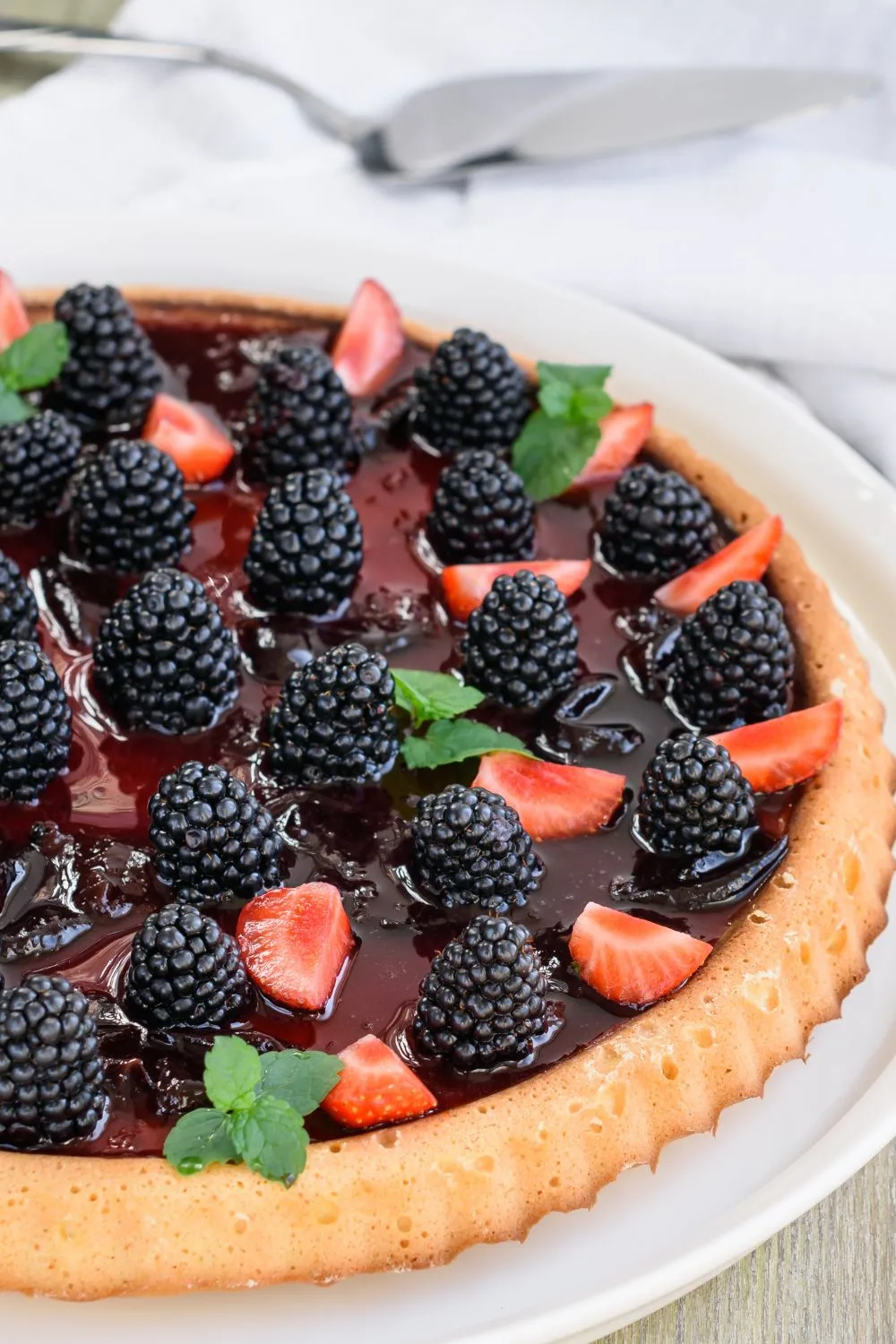 berry tart on a white serving dish