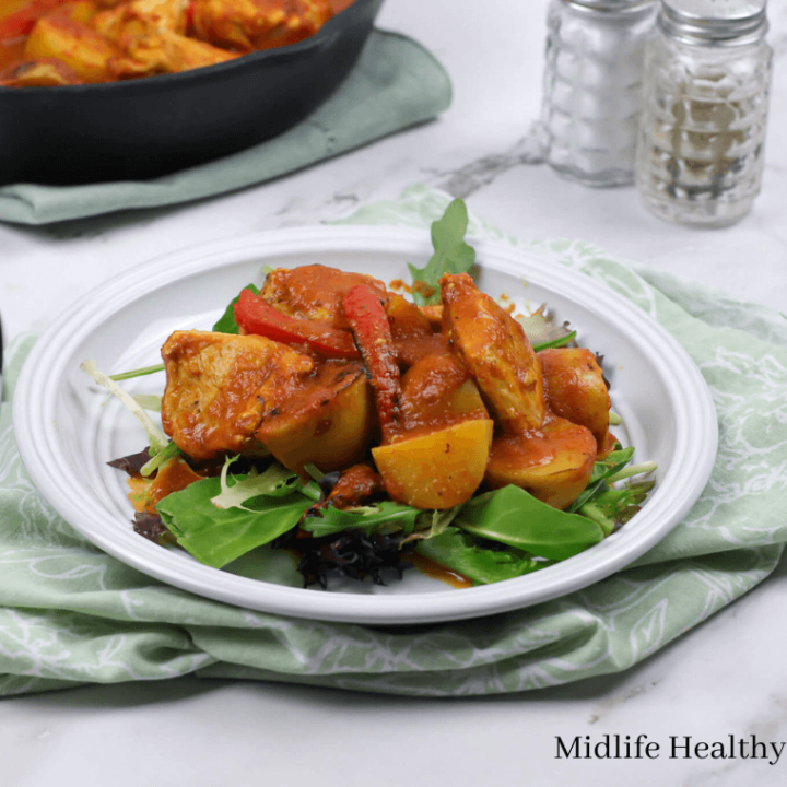 chicken potato peppers in a skillet