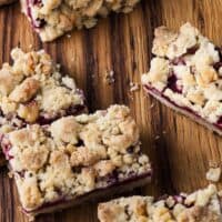 raspberry oat bars on a cutting board