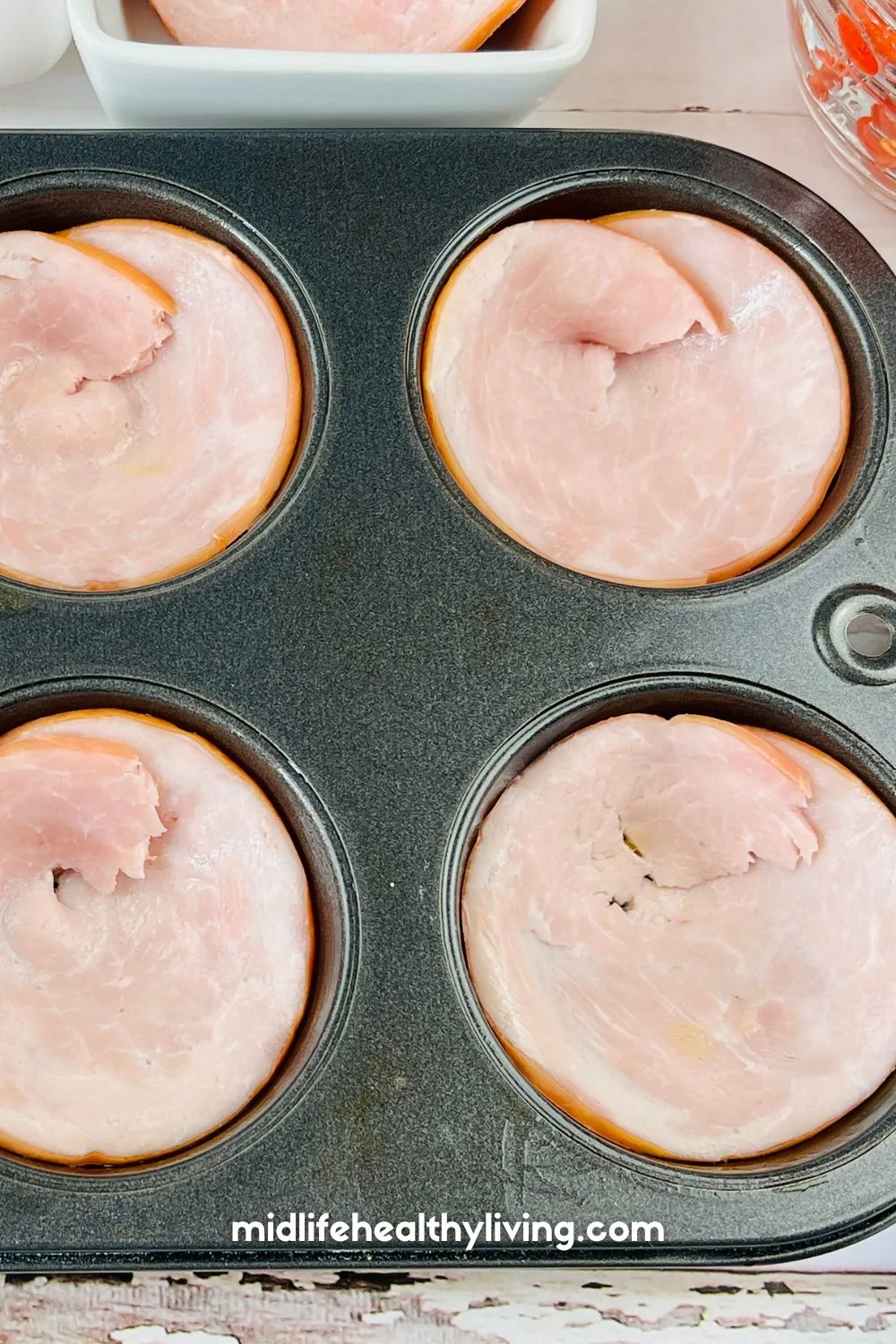 Canadian bacon in a muffin tin