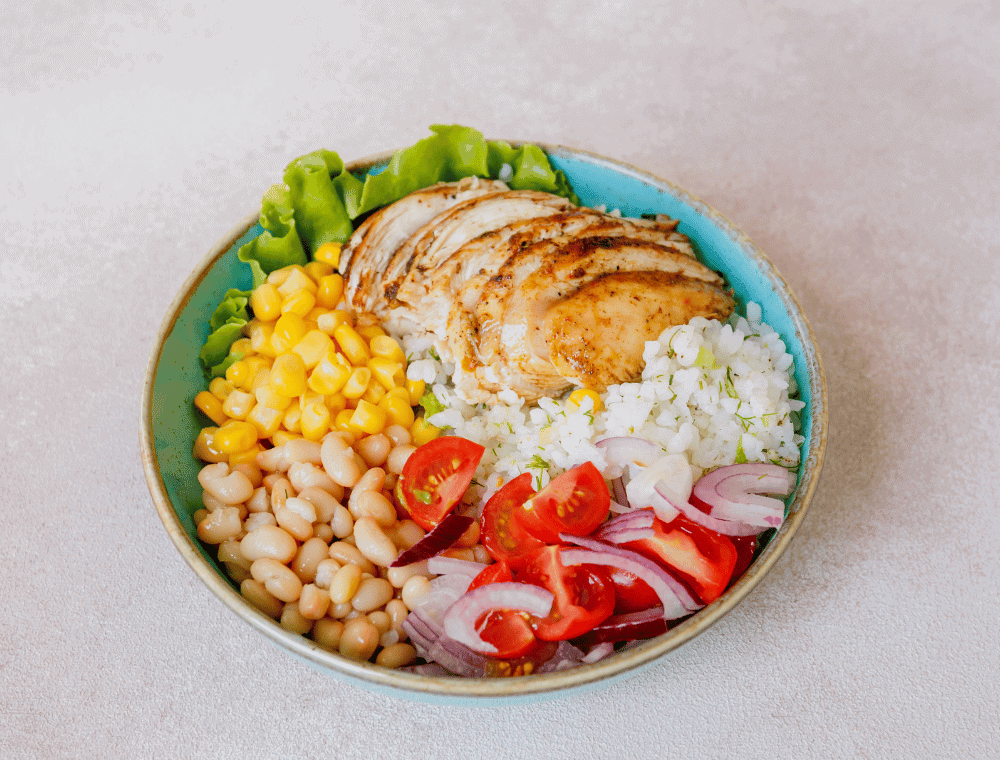 fresh vegetables and chicken in bowl for ww chicken burrito bowl