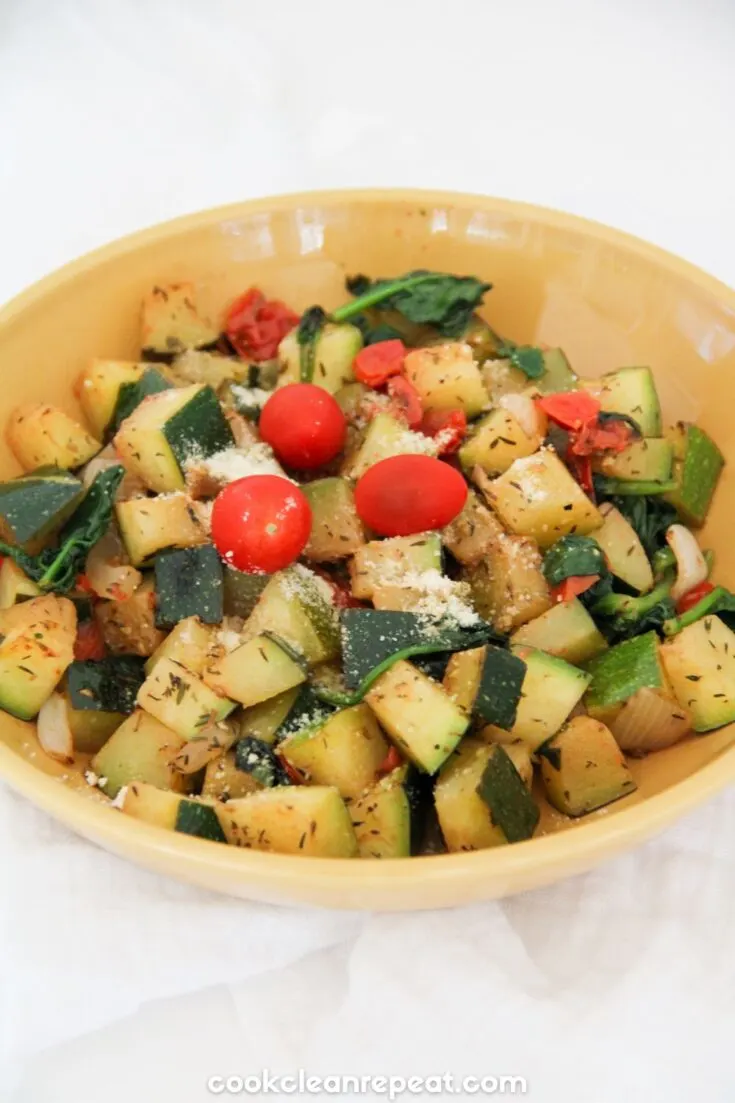 zucchini skillet meal served in a yellow bowl