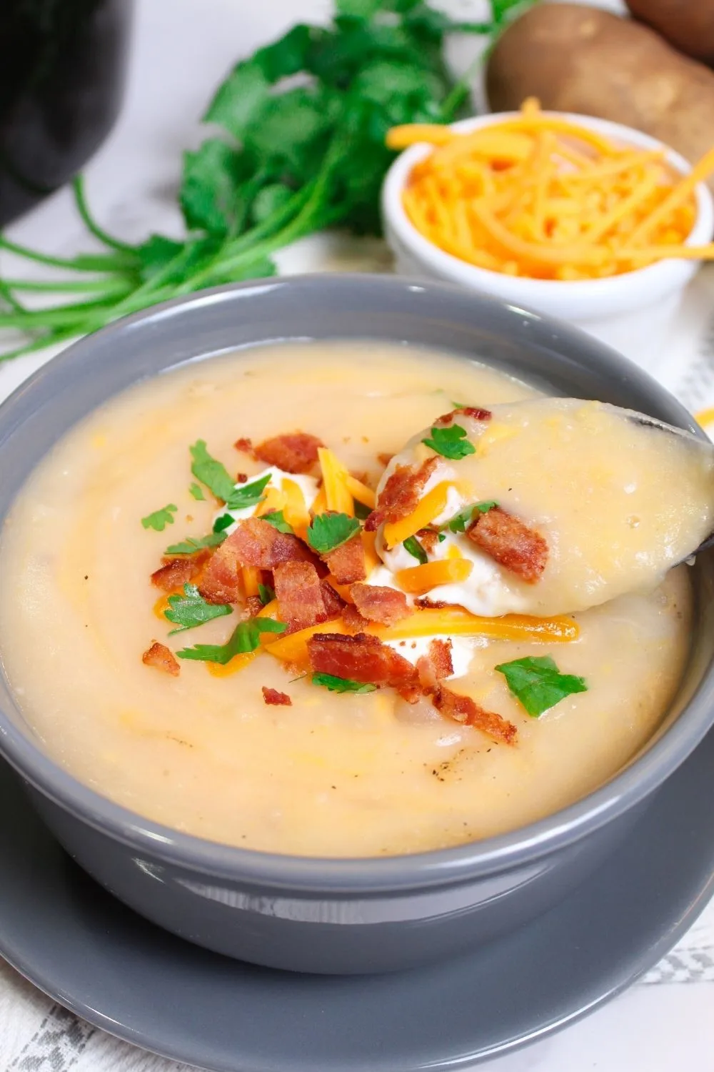 up close shot of Weight Watchers potato soup in a bowl with a spoon
