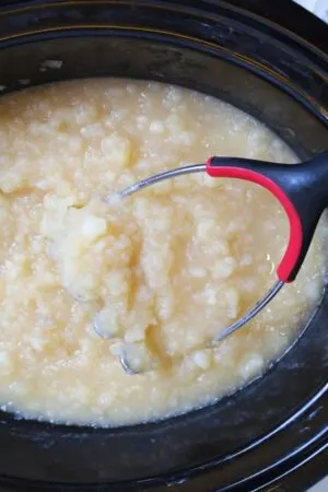 potatoes being mashed up into small bits