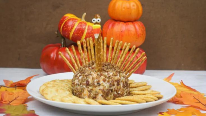 A cheese ball with pretzels to form a turkey.