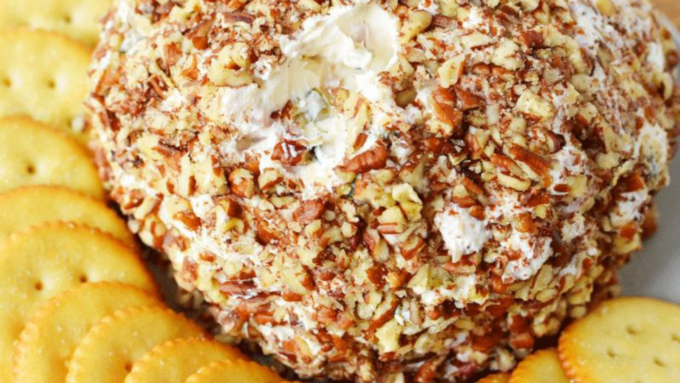 A cheese ball made of ham, green onion and pecans.