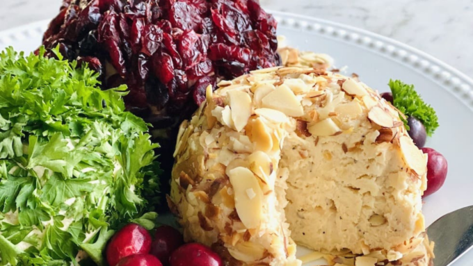 A trio of cheese balls rolled in almonds, herbs and cranberries.