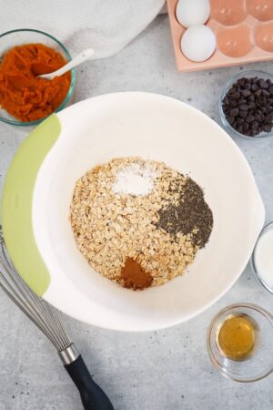 adding dry ingredients to mixing bowls