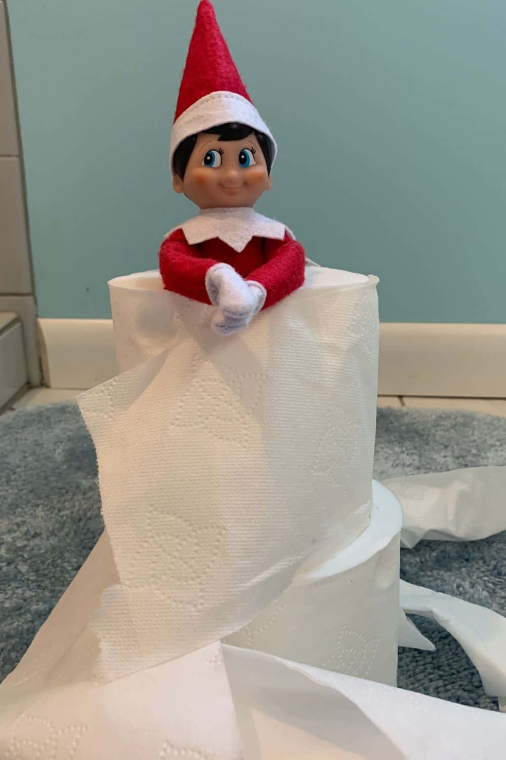 Elf on the Shelf hiding in toilet paper