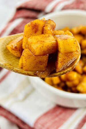 apple pie filing on a wooden spoon