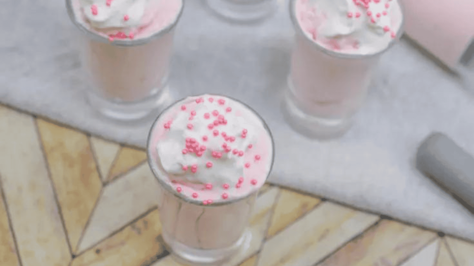 Jars of pink cheesecake.