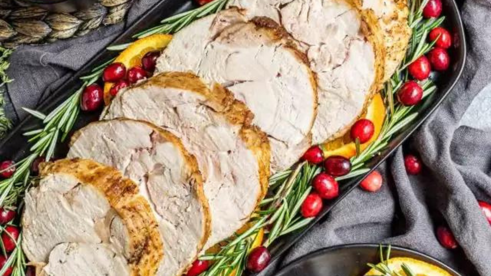  A sliced turkey breast with cranberry sauce.