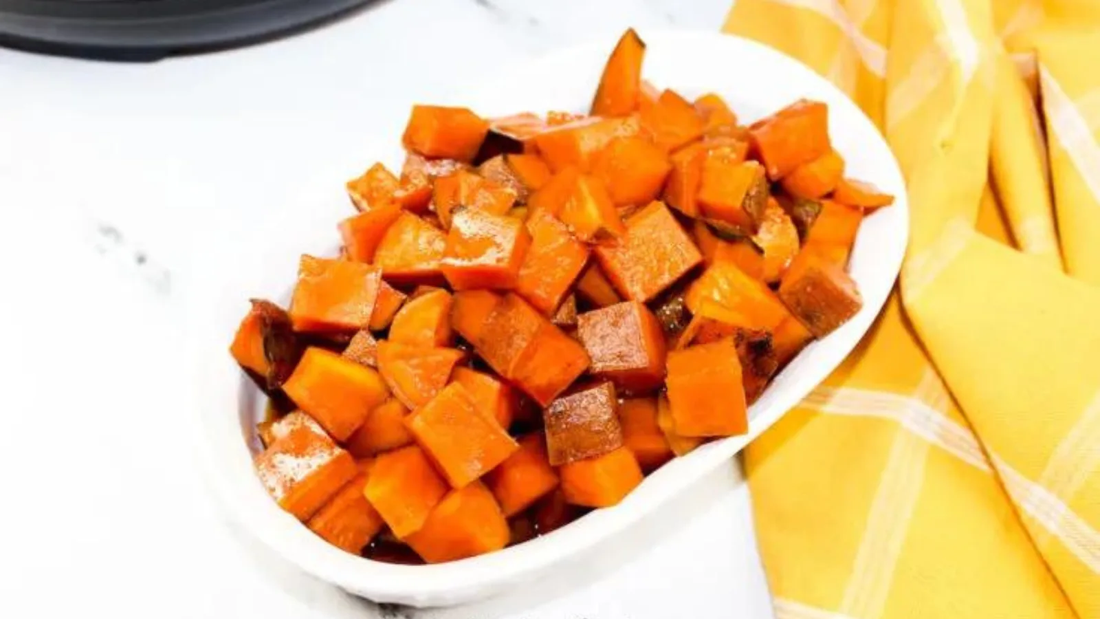 A bowl of sweet potato cubes cooked in an instant pot.