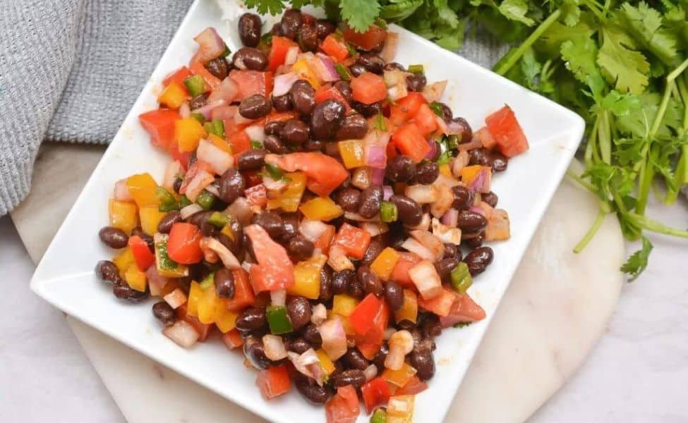 A plate of cowboy caviar with keto ingredients.