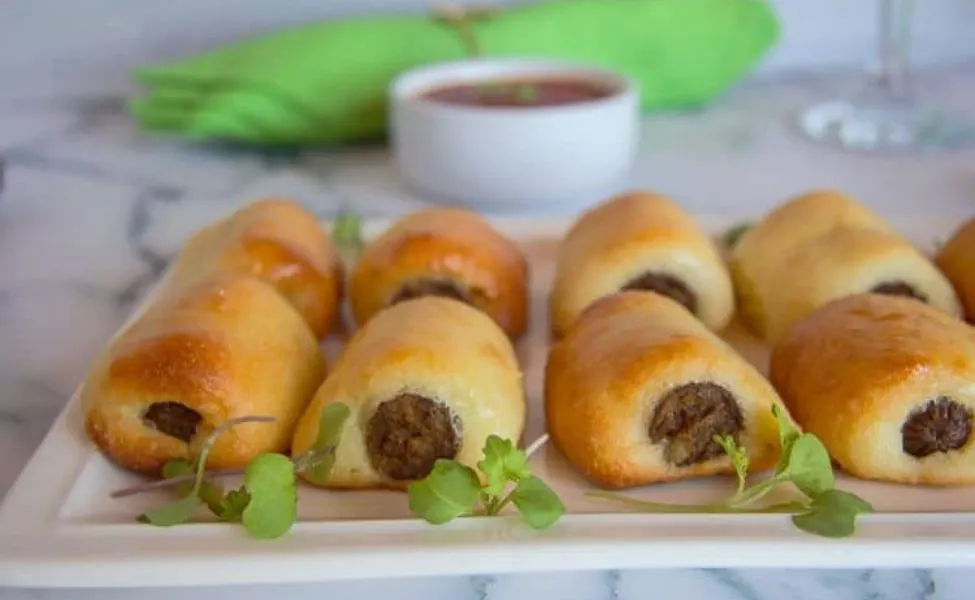  Sausages wrapped in keto friendly dough, for appetizers.