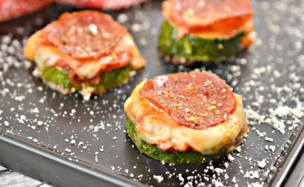 Zucchini slices with pepperoni and cheese over top.