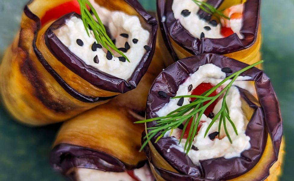 Eggplant slices stuffed with cheese and tomatoes.